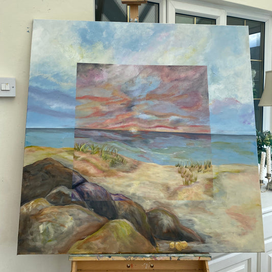 Abstract painting on an easel against a white wall